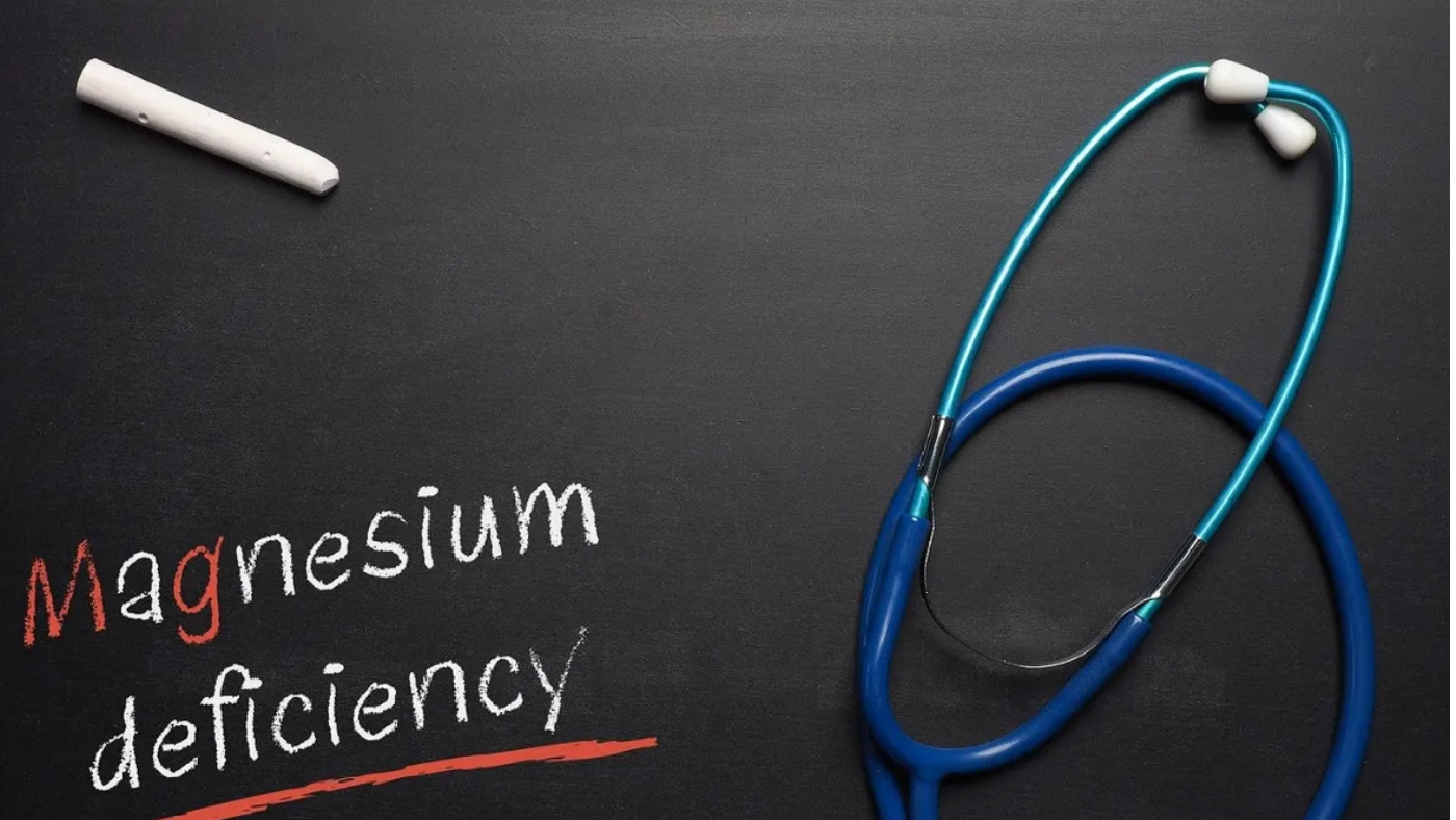 Blackboard with the words Magnesium deficiency and a stethoscope, medical or health care concept