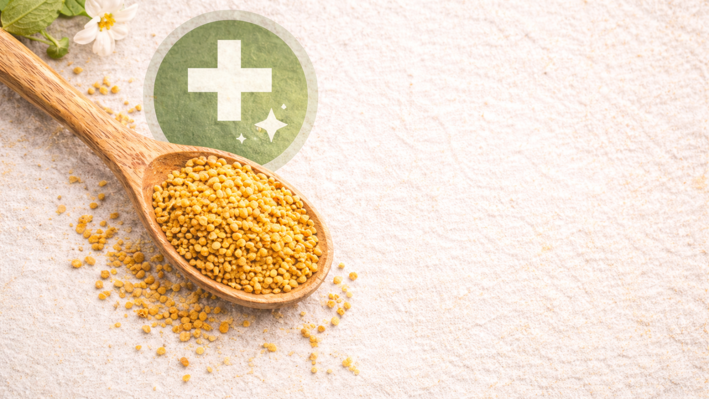 Spoonful of bee pollen granules with a medicine sign on a pale pink background
