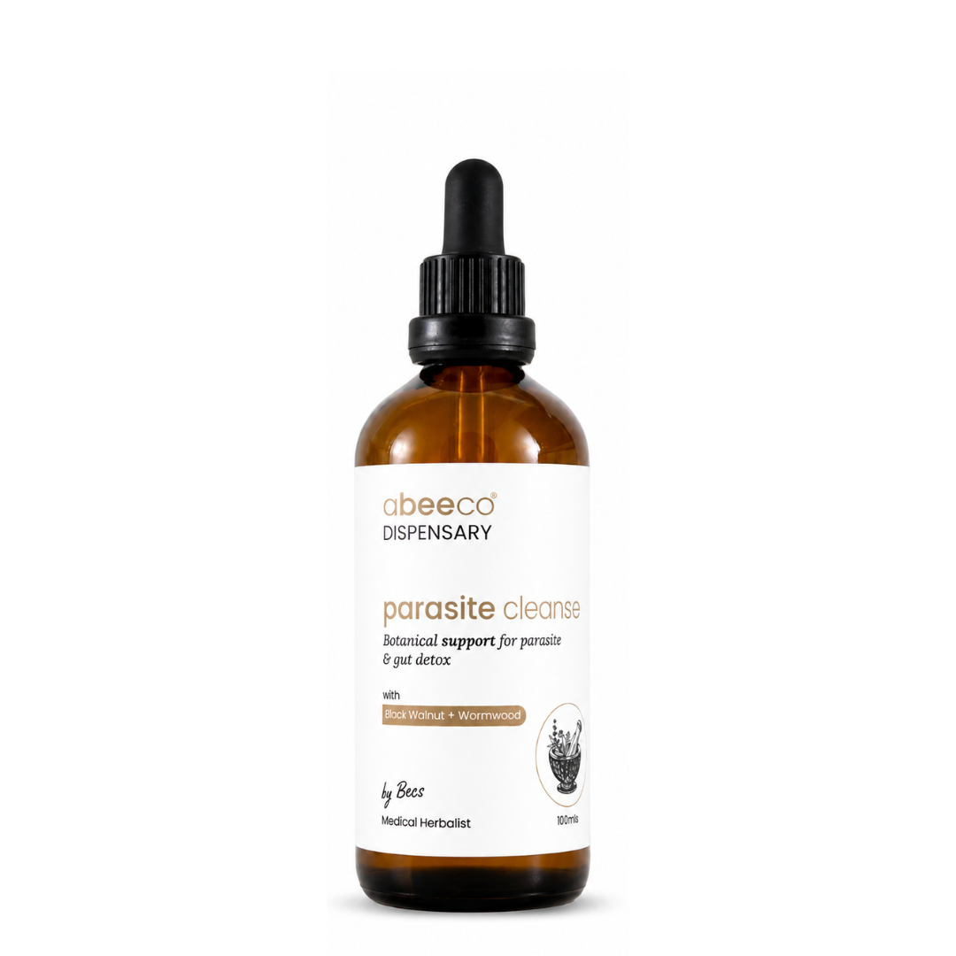 An amber glass dropper bottle of abeeco DISPENSARY 'parasite cleanse' herbal supplement on a solid white background.