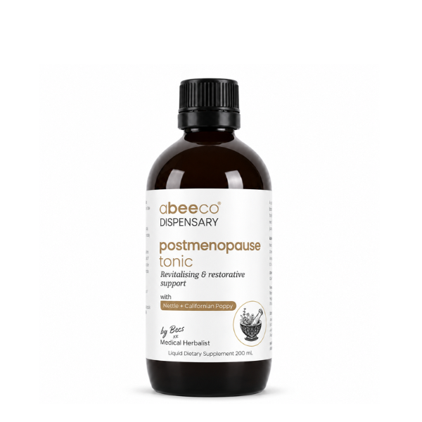 A 200 mL amber glass bottle of abeeco Dispensary postmenopause tonic with a black ribbed cap and a white label, set against a plain white background.