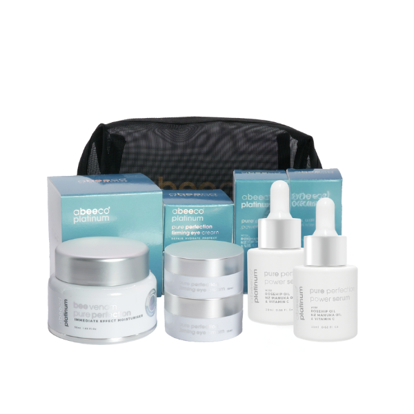 Skincare product set with jars, bottles, and a pouch on a white background