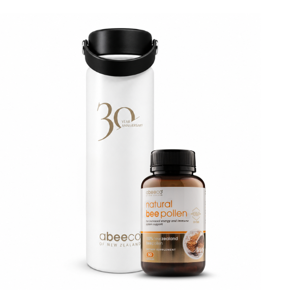 Abeeco natural bee pollen supplement bottle and a white thermos with black lid on a white background.